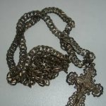 Why do silver chains darken and need cleaning?